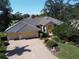 House exterior with tile roof and landscaped yard at 269 Royal Oak Way, Venice, FL 34292