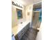 Clean bathroom with a vanity, mirror and shower at 28 Castaway Ct, North Port, FL 34287