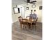 Charming dining room featuring a wood table and four chairs at 28 Castaway Ct, North Port, FL 34287