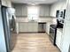 Modern kitchen with stainless steel appliances and granite countertops at 28 Castaway Ct, North Port, FL 34287