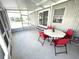 Spacious screened-in porch with outdoor seating at 28 Castaway Ct, North Port, FL 34287