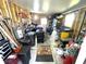 Workshop with storage shelving and workbenches at 28 Castaway Ct, North Port, FL 34287