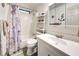 Clean bathroom with shower/tub combo, vanity, and updated flooring at 3022 Audubon Ave, Englewood, FL 34224