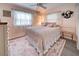 Bedroom with queen-size bed and window seating at 3022 Audubon Ave, Englewood, FL 34224