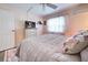 Bedroom with queen-size bed and TV at 3022 Audubon Ave, Englewood, FL 34224