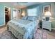 Bedroom with king-size bed, ensuite bathroom, and closet at 3022 Audubon Ave, Englewood, FL 34224