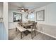 Bright dining area with table, bench, and four chairs at 3022 Audubon Ave, Englewood, FL 34224