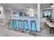 Kitchen island with seating and modern appliances at 3022 Audubon Ave, Englewood, FL 34224
