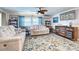 Living room features stylish sofas, decorative rug, and built-in shelving at 3022 Audubon Ave, Englewood, FL 34224