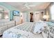 Main bedroom with large bed, dresser, and walk-in closet at 3022 Audubon Ave, Englewood, FL 34224