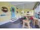 Screened porch with nautical theme and seating area at 3022 Audubon Ave, Englewood, FL 34224