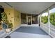 Screened porch with patio furniture and white picket fence at 3022 Audubon Ave, Englewood, FL 34224