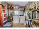 Large storage area with washer, dryer, and additional shelving at 3022 Audubon Ave, Englewood, FL 34224
