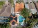 Bird's eye view of the property, showing the house, pool, and surrounding homes at 321 Pedro St, Venice, FL 34285