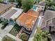 Aerial view of the house, showing the orange roof and yard at 321 Pedro St, Venice, FL 34285