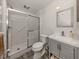 Updated bathroom with walk-in shower, gray vanity, and patterned floor at 321 Pedro St, Venice, FL 34285