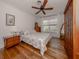 Bright bedroom with hardwood floors and a ceiling fan at 321 Pedro St, Venice, FL 34285