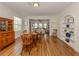 Charming dining room with hardwood floors and built-in shelving at 321 Pedro St, Venice, FL 34285