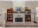 Decorative fireplace with tiled hearth and built-in bookcases at 321 Pedro St, Venice, FL 34285