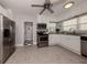 Modern kitchen features stainless steel appliances and white cabinetry at 321 Pedro St, Venice, FL 34285