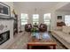 Bright living room with a fireplace, comfy seating, and plenty of natural light at 321 Pedro St, Venice, FL 34285