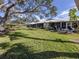 Expansive grassy backyard, providing ample space at 335 Englewood Isles Pkwy # 55, Englewood, FL 34223