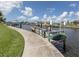 Private boat dock with kayak storage, perfect for enjoying the waterfront lifestyle at 335 Englewood Isles Pkwy # 55, Englewood, FL 34223