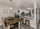 Rustic dining area with large table and kitchen views at 335 Englewood Isles Pkwy # 55, Englewood, FL 34223