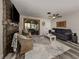 Living room with hardwood floors, fireplace, and plenty of natural light at 335 Englewood Isles Pkwy # 55, Englewood, FL 34223