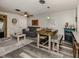 Bright living room features hardwood floors, comfy seating, and a fireplace at 335 Englewood Isles Pkwy # 55, Englewood, FL 34223