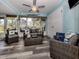 Bright sunroom with wicker furniture and plenty of natural light at 335 Englewood Isles Pkwy # 55, Englewood, FL 34223