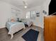 Bright bedroom with twin beds, natural light, and a cheerful, beach-inspired decor at 335 Sunset Lake Blvd, Venice, FL 34292