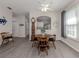Cozy dining area with hardwood floors and a view of the kitchen at 335 Sunset Lake Blvd, Venice, FL 34292