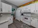 Bright kitchen features white appliances, ample countertop space, and modern finishes at 335 Sunset Lake Blvd, Venice, FL 34292