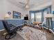 Cozy living room with blue accent walls, bay windows, stylish furniture, and decor at 335 Sunset Lake Blvd, Venice, FL 34292