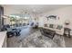 Bright living room with open lanai access, neutral colors, and stylish furnishings at 335 Sunset Lake Blvd, Venice, FL 34292