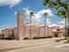Exterior of the Venice Theater with a tower, palm trees, and box office at 335 Sunset Lake Blvd, Venice, FL 34292