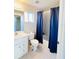 Bathroom with white vanity, toilet, and bathtub at 3400 Rain Lily, Englewood, FL 34224