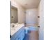 Clean bathroom with a shower/tub combo and white vanity at 3400 Rain Lily, Englewood, FL 34224