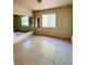 Bedroom with tile floors and mirrored walls at 3400 Rain Lily, Englewood, FL 34224