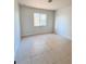 Bright bedroom with tile floors and a large window at 3400 Rain Lily, Englewood, FL 34224