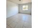 Spacious bedroom with tile flooring and window at 3400 Rain Lily, Englewood, FL 34224