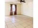 Spacious living room with tile flooring and ceiling fan at 3400 Rain Lily, Englewood, FL 34224