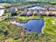 Aerial view showcasing house location near a pond and golf course at 4259 Whispering Oaks Dr, North Port, FL 34287