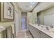 Elegant bathroom with double vanity and walk-in shower at 4259 Whispering Oaks Dr, North Port, FL 34287