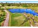 Peaceful golf course view with pond and walking path at 4259 Whispering Oaks Dr, North Port, FL 34287