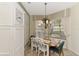 Cozy kitchen nook with a wooden table and green chairs at 4259 Whispering Oaks Dr, North Port, FL 34287