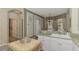 Kitchen with light-colored cabinets, a large sink, and an adjacent dining area at 4259 Whispering Oaks Dr, North Port, FL 34287