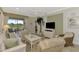 Living room with comfortable seating and access to a patio at 4259 Whispering Oaks Dr, North Port, FL 34287