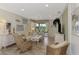 Spacious living room featuring a comfortable seating area and access to a patio at 4259 Whispering Oaks Dr, North Port, FL 34287
